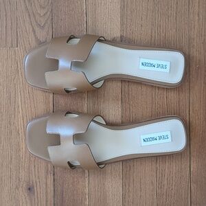 Brand new in box. Steve Madden slides size 9